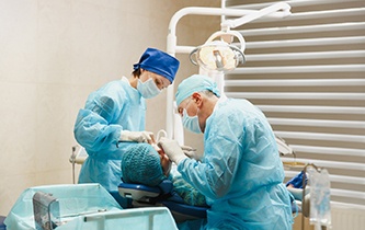 Oral surgeons inserting dental implants in Little Rock, AZ