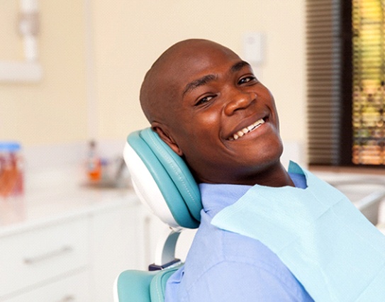 Man smiles after advanced dental implant procedures in Little Rock