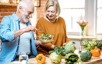 An older couple eating healthy foods