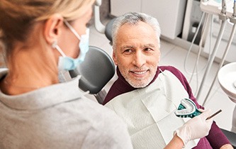 An elderly man receiving dental impressions for dentures