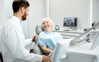 a patient talking to her dentist about dentures 