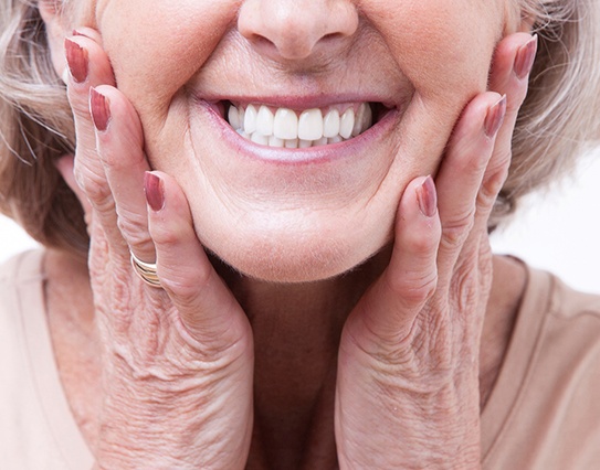 closeup of woman smiling with dentures