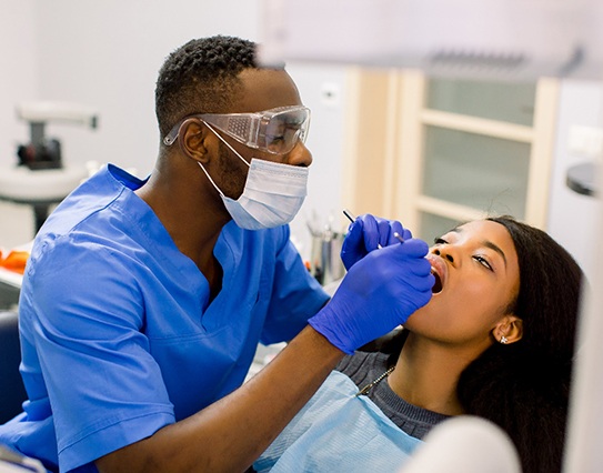 a dentist treating a patient