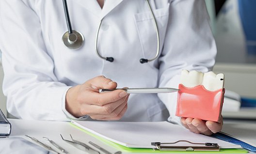 Gum recontouring uses a soft tissue laser to remove excess gum tissue and reveal more tooth structure