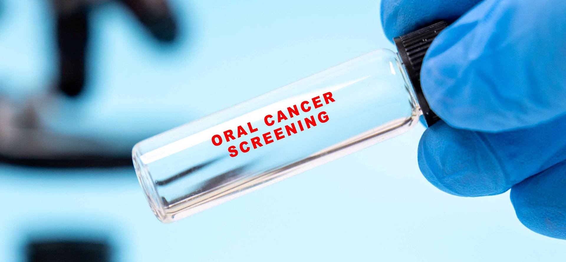 A test tube that says oral cancer screening