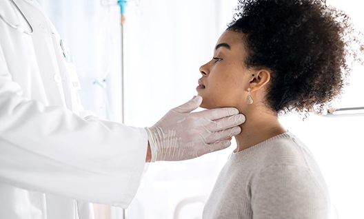 A dentist performing an oral cancer screening