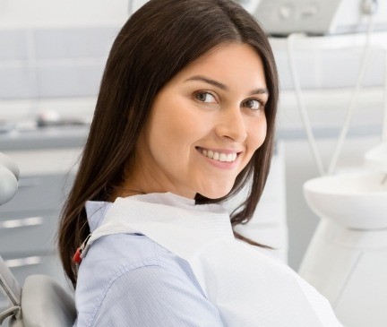Woman smiling during preventive dentistry appointment