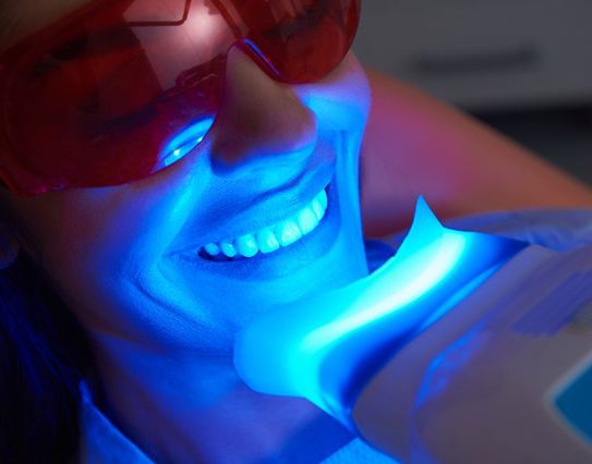woman getting in-office teeth whitening 