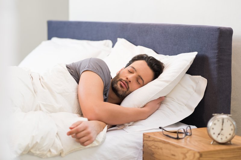 Man sleeping after receiving sleep apnea therapy