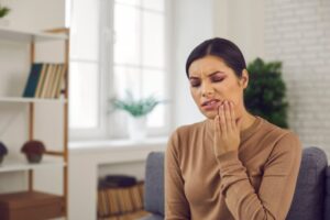 woman with facial swelling and pain